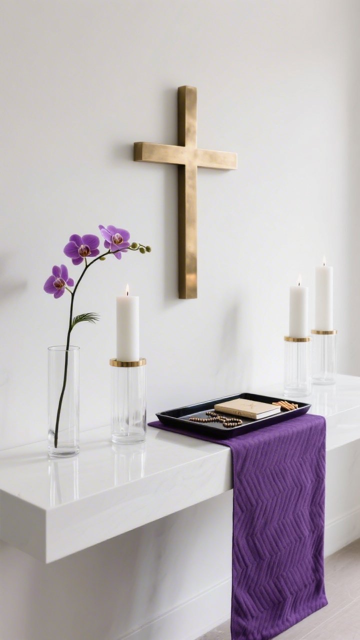 Photorealistic straight-on medium shot of a modern altar on a sleek white console or floating shelf; deep purple runner with subtle herringbone or linen texture; a brushed brass cross centered; symmetrical low glass hurricanes with white pillar candles on either side; color story of violet, white, and brass with a micro hit of charcoal accents; a single orchid stem or a monopod palm frond in a clear cylinder vase; a slim lacquer tray holding a rosary, journal, and matches; crisp, gallery-clean lighting with soft reflections, no clutter.